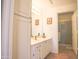 Well-lit bathroom features white cabinets, vanity, and framed mirror at 7009 E Acoma Dr # 1160, Scottsdale, AZ 85254