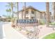 Exterior view of community signage 'The Plaza Residences' surrounded by desert landscaping at 7009 E Acoma Dr # 1160, Scottsdale, AZ 85254
