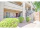 Charming condo showcasing balconies, exterior stairs, sliding glass doors, and manicured bushes at 7009 E Acoma Dr # 1160, Scottsdale, AZ 85254