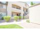 Inviting condo exterior featuring multiple balconies, exterior staircases, and lush bushes at 7009 E Acoma Dr # 1160, Scottsdale, AZ 85254