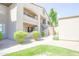 Three-story condo building with well-maintained landscaping and exterior stairs to upper units at 7009 E Acoma Dr # 1160, Scottsdale, AZ 85254