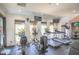 Fitness center featuring cardio equipment and free weights with a view of the community landscaping at 7009 E Acoma Dr # 1160, Scottsdale, AZ 85254