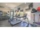 Community gym featuring modern treadmills, elliptical machines, free weights, and wall-mounted televisions at 7009 E Acoma Dr # 1160, Scottsdale, AZ 85254