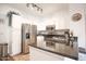 Bright kitchen with white cabinets, granite counters and stainless steel appliances; ample countertop space at 7009 E Acoma Dr # 1160, Scottsdale, AZ 85254