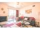 Cozy living room with a fireplace and balcony access, perfect for relaxation and entertaining at 7009 E Acoma Dr # 1160, Scottsdale, AZ 85254