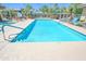 Resort-style community swimming pool surrounded by lounge chairs and lush landscaping at 7009 E Acoma Dr # 1160, Scottsdale, AZ 85254
