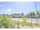 A street view of shopping and residential area with landscaping and flowers in foreground at 7009 E Acoma Dr # 1160, Scottsdale, AZ 85254