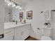 A bathroom featuring a light sconce, mirror, vanity, and toilet at 736 N Meadows Dr, Chandler, AZ 85224
