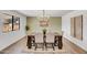 Well lit dining area featuring a wood table, seating for six, decor, and a window with natural light at 736 N Meadows Dr, Chandler, AZ 85224