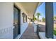 View of front porch featuring new front door, landscaping, and exterior lighting at 736 N Meadows Dr, Chandler, AZ 85224