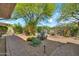 Landscaped backyard featuring a desert garden, including cactus and greenery, plus brick patio at 7500 E Pontebella Dr, Scottsdale, AZ 85266
