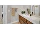 Bathroom features a vanity with decorative jars, a large mirror and a towel bar with towels at 7500 E Pontebella Dr, Scottsdale, AZ 85266