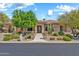 Charming home with desert landscaping, mature trees, and covered entry at 7500 E Pontebella Dr, Scottsdale, AZ 85266