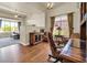 Inviting home office featuring hardwood floors, a large window, and lots of natural light at 7500 E Pontebella Dr, Scottsdale, AZ 85266