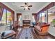 Inviting living room featuring hardwood floors and large windows offering ample natural light at 7500 E Pontebella Dr, Scottsdale, AZ 85266