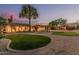 Private backyard with artificial turf, gravel, and mature trees, perfect for outdoor entertaining and relaxation at 8220 W Mariposa Grande Ln, Peoria, AZ 85383