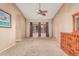Inviting bedroom with a ceiling fan, warm paint and natural light at 8220 W Mariposa Grande Ln, Peoria, AZ 85383