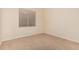 Bedroom featuring carpet, a window with blinds, and neutral walls to match the rest of the room at 8220 W Mariposa Grande Ln, Peoria, AZ 85383