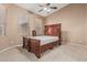 Bedroom featuring neutral walls, carpet, and a large window allowing natural light to enter at 8220 W Mariposa Grande Ln, Peoria, AZ 85383