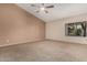 Spacious bedroom with neutral carpet and ample natural light at 8220 W Mariposa Grande Ln, Peoria, AZ 85383