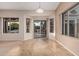 Bright dining area with tile flooring and sliding glass doors to the outdoor living space at 8220 W Mariposa Grande Ln, Peoria, AZ 85383
