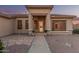 Close up shot of the front door and entrance on home with gravel landscaping at 8220 W Mariposa Grande Ln, Peoria, AZ 85383