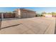 Spacious three car garage with concrete driveway and desert landscaping at 8220 W Mariposa Grande Ln, Peoria, AZ 85383