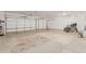 Garage features concrete floor and white doors at 8220 W Mariposa Grande Ln, Peoria, AZ 85383