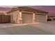 Spacious garage with concrete driveway on a home with desert landscaping at 8220 W Mariposa Grande Ln, Peoria, AZ 85383