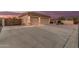 Spacious garage with concrete driveway and walkway on a home with tile roof at 8220 W Mariposa Grande Ln, Peoria, AZ 85383