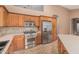 Kitchen featuring stainless steel appliances, gas range, and ample storage, ready for culinary creativity at 8220 W Mariposa Grande Ln, Peoria, AZ 85383