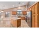 Gourmet kitchen with stainless steel appliances, island, and lots of natural light, ready for your culinary adventures at 8220 W Mariposa Grande Ln, Peoria, AZ 85383