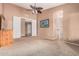 Spacious main bedroom featuring neutral walls, plush carpet, and an ensuite bathroom entrance at 8220 W Mariposa Grande Ln, Peoria, AZ 85383