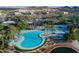 The community features a resort style pool area with lounging chairs and palm trees at 9747 S 182Nd Dr, Goodyear, AZ 85338
