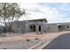 Exterior view of the Estrella Golf Club entrance, featuring architectural details and landscaping at 9747 S 182Nd Dr, Goodyear, AZ 85338