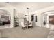 Spacious living and dining space, showcasing open concept and seamless transition to other rooms at 9747 S 182Nd Dr, Goodyear, AZ 85338