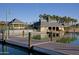Scenic dock with covered lakeside building offering picturesque waterfront views and paddle boat rentals at 9747 S 182Nd Dr, Goodyear, AZ 85338