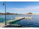 Picturesque dock with seating offers serene lake views and enhances community's tranquil ambiance at 9747 S 182Nd Dr, Goodyear, AZ 85338