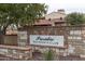 Elegant stone sign marking the entrance to the Presidio Residents Club, surrounded by lush landscaping at 9747 S 182Nd Dr, Goodyear, AZ 85338