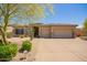 Charming single-story home featuring a well-manicured desert landscape and a spacious two-car garage at 9747 S 182Nd Dr, Goodyear, AZ 85338
