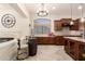 Kitchen view shows wine barrel seating and updated kitchen with granite counters at 9747 S 182Nd Dr, Goodyear, AZ 85338