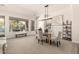 Bright living and dining area with outdoor views, comfortable seating, and stylish decor at 9747 S 182Nd Dr, Goodyear, AZ 85338