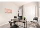 Functional office space with a desk, dual chairs, and stylish decor for a productive work environment at 9747 S 182Nd Dr, Goodyear, AZ 85338