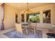 Relaxing patio area with a round table, seating, and an open view to a backyard at 9747 S 182Nd Dr, Goodyear, AZ 85338