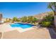 Backyard pool boasts desert landscaping, creating a private and scenic outdoor space at 9747 S 182Nd Dr, Goodyear, AZ 85338