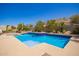 Inviting pool area with lush landscaping and serene desert views for ultimate relaxation and enjoyment at 9747 S 182Nd Dr, Goodyear, AZ 85338