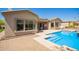 View of the backyard pool with spa and patio area, perfect for outdoor entertaining and relaxation at 9747 S 182Nd Dr, Goodyear, AZ 85338