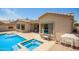 View of the luxurious pool and spa, as well as outdoor seating; excellent for enjoying the sunny weather at 9747 S 182Nd Dr, Goodyear, AZ 85338