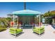 Inviting poolside lounge area with modern seating, offering a relaxing space near the community swimming pool at 9747 S 182Nd Dr, Goodyear, AZ 85338