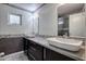 Stylish bathroom featuring dual sinks, granite countertops, and modern fixtures at 11035 N 37Th St, Phoenix, AZ 85028